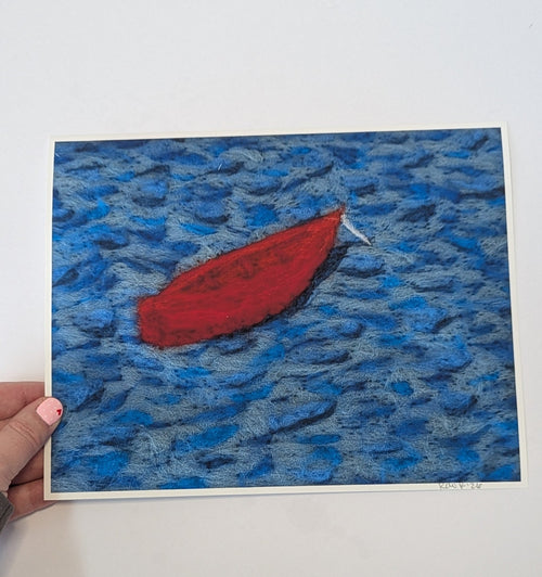 Artistic depiction of a red object on blue water with a hand holding the artwork.