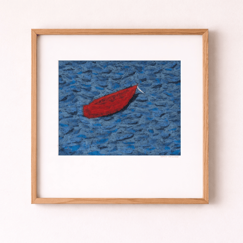 Framed artwork of a red boat on blue water